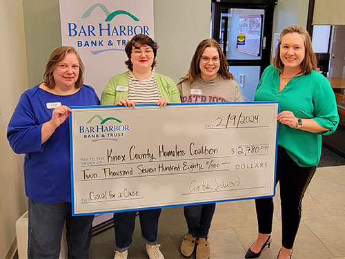 BHBT employees present a donation to Knox County Homeless Coalition