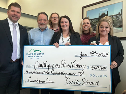BHBT employees present a donation to PathWays of the River Valley